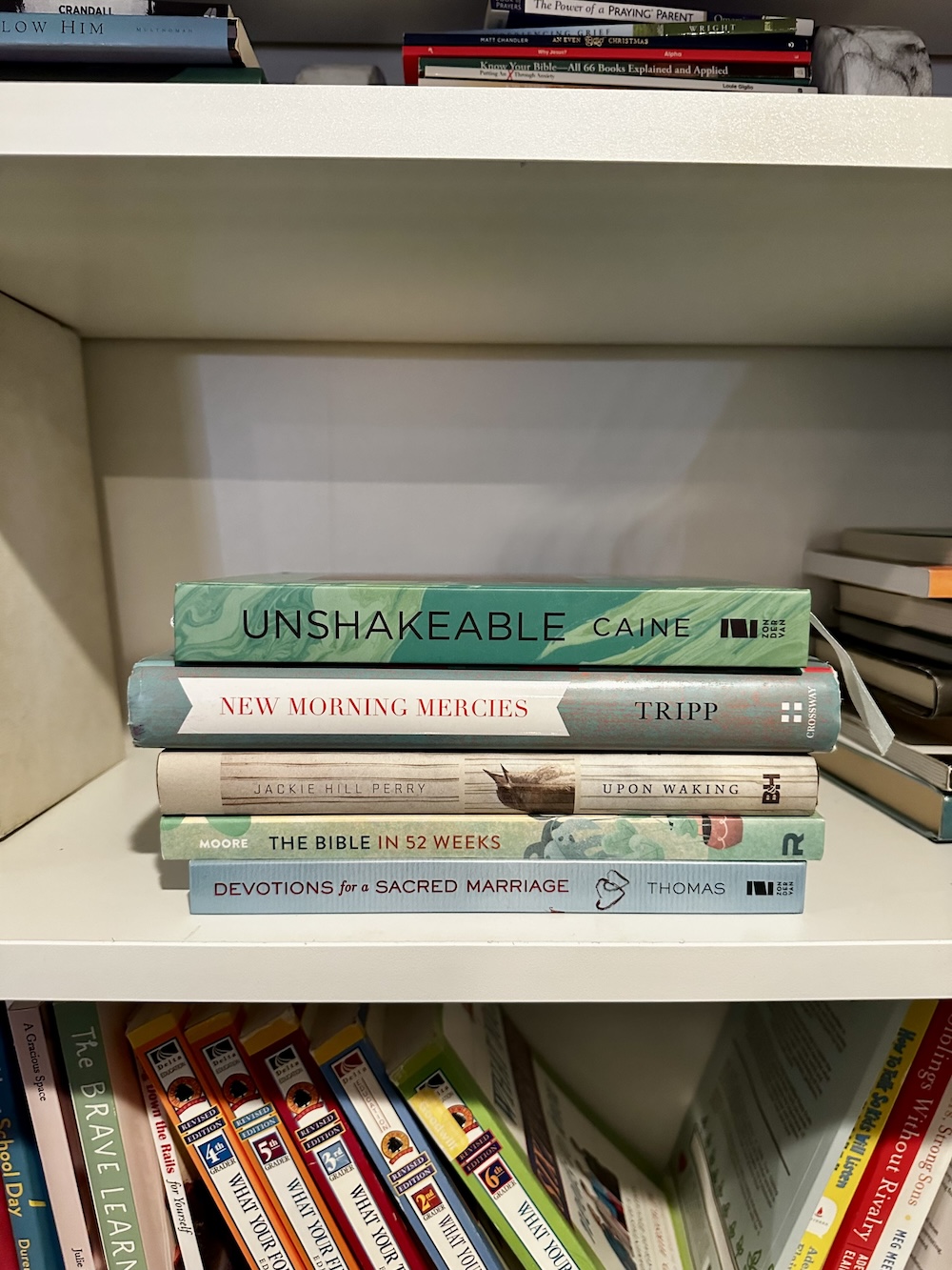 stack of books on a bookshelf